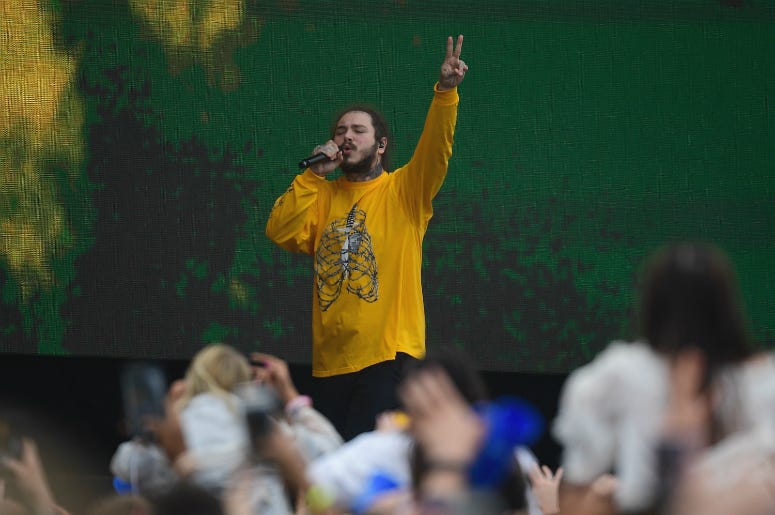 May 19, 2018; Baltimore, MD, USA; American rapper Post Malone performs in the infield prior to the running of the 143rd Preakness Steaks at Pimlico Race Course. May 19, 2018; Baltimore, MD, USA; American rapper Post Malone performs in the infield prior to the running of the 143rd Preakness Steaks at Pimlico Race Course.