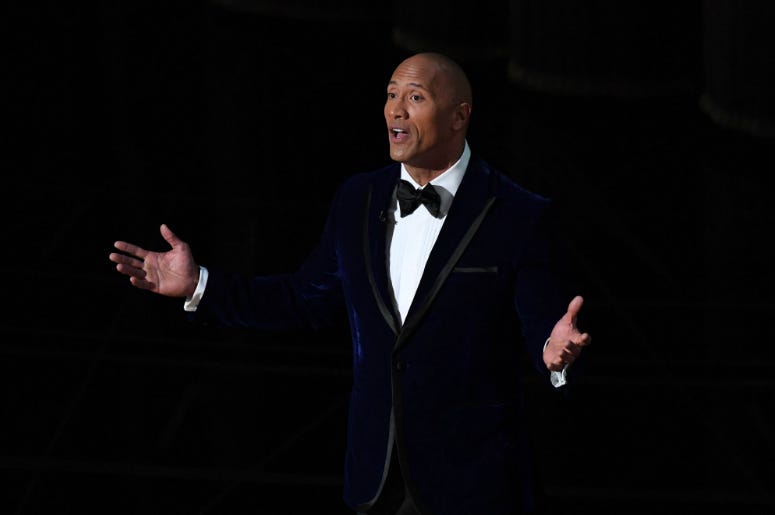 Dwayne "The Rock" Johnson during the 89th Academy Awards. Dwayne "The Rock" Johnson introduces Lin Manuel Miranda and Auli'i Cravalho as they perform 'How Far I ll Go' from 'Moana' during the 89th Academy Awards at Dolby Theatre.