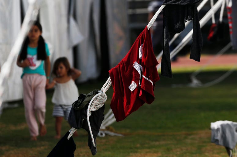 Fotografía de archivo del lunes 28 de enero de 2019 de inmigrantes centroamericanos instalados en un refugio en el estadio Jesús Martínez de la Ciudad de México. Fotografía de archivo del lunes 28 de enero de 2019 de inmigrantes centroamericanos instalados en un refugio en el estadio Jesús Martínez de la Ciudad de México.