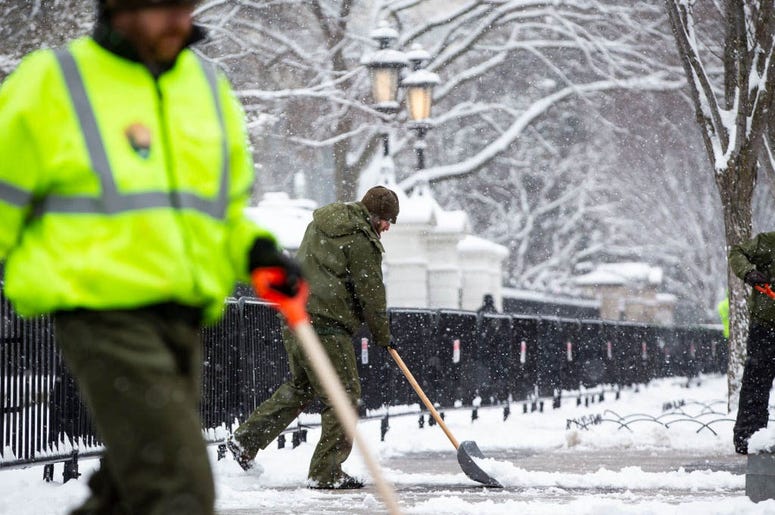 WASHINGTON, DC - JANUARY 13: National Park Service workers shovel snow outside of the White House, on January 13, 2019 in Washington, DC. The DC area was hit with 4-7 inches of snow accumulation with the potential of another 2-4 inches. WASHINGTON, DC - JANUARY 13: National Park Service workers shovel snow outside of the White House, on January 13, 2019 in Washington, DC. The DC area was hit with 4-7 inches of snow accumulation with the potential of another 2-4 inches.