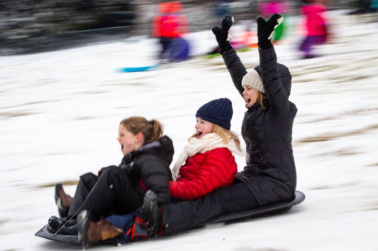 WASHINGTON, DC - JANUARY 13: People sled on the west side of the U.S. Capitol, on January 13, 2019 in Washington, DC. The DC area was hit with 4-7 inches of snow accumulation with the potential of another 2-4 inches. WASHINGTON, DC - JANUARY 13: People sled on the west side of the U.S. Capitol, on January 13, 2019 in Washington, DC. The DC area was hit with 4-7 inches of snow accumulation with the potential of another 2-4 inches.