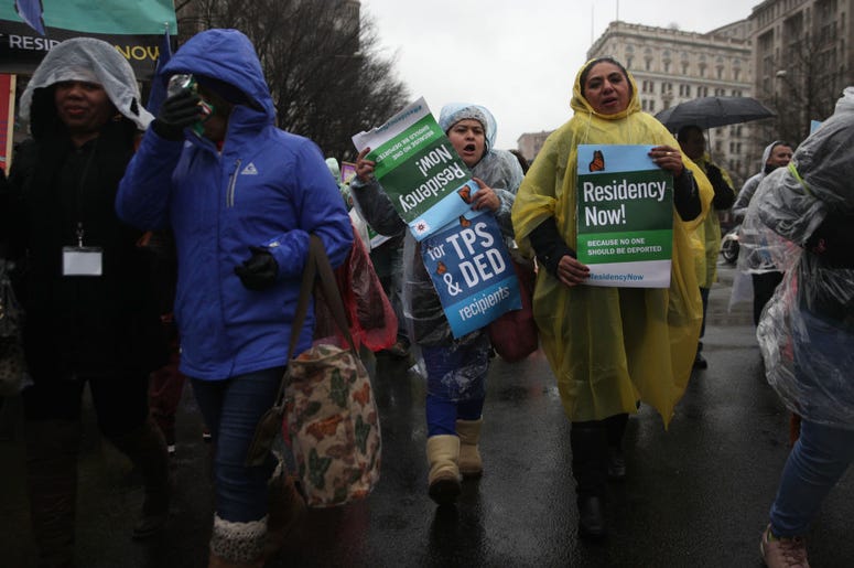 Immigration activists participate in a march February 12, 2019 in Washington, DC. Activists called on Congress to put permanent protections on Temporary Protected Status (TPS) holders Immigration activists participate in a march February 12, 2019 in Washington, DC. Activists called on Congress to put permanent protections on Temporary Protected Status (TPS) holders