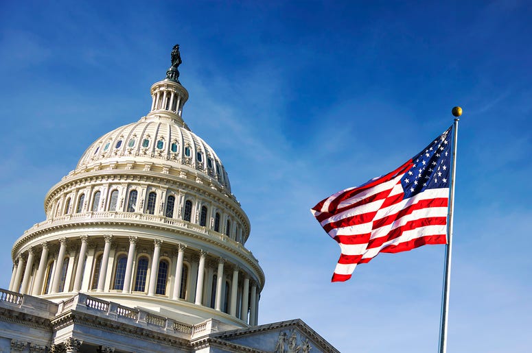 American flag waving with the Capitol Hil American flag waving with the Capitol Hil