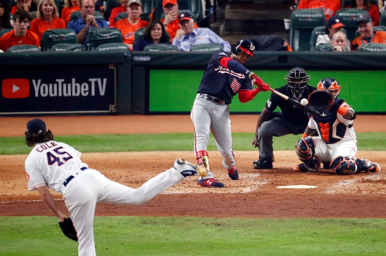 Juan Soto #22 of the Washington Nationals hits a solo home run on a pitch from Gerrit Cole #45 of the Houston Astros during the fourth inning in Game One of the 2019 World Series at Minute Maid Park on October 22, 2019 in Houston, Texas. Juan Soto #22 of the Washington Nationals hits a solo home run on a pitch from Gerrit Cole #45 of the Houston Astros during the fourth inning in Game One of the 2019 World Series at Minute Maid Park on October 22, 2019 in Houston, Texas.