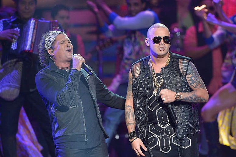 MIAMI, FL - APRIL 30: Carlos Vives (L) and Wisin perform onstage at the 2015 Billboard Latin Music Awards presented bu State Farm on Telemundo at Bank United Center on April 30, 2015 in Miami, Florida. MIAMI, FL - APRIL 30: Carlos Vives (L) and Wisin perform onstage at the 2015 Billboard Latin Music Awards presented bu State Farm on Telemundo at Bank United Center on April 30, 2015 in Miami, Florida.