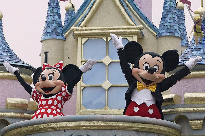 Disney characters Mickey Mouse and Minnie Mouse perform during the parade at Hong Kong Disneyland on September 11, 2005 in Hong Kong. The new theme park is scheduled to have its grand opening September 12.