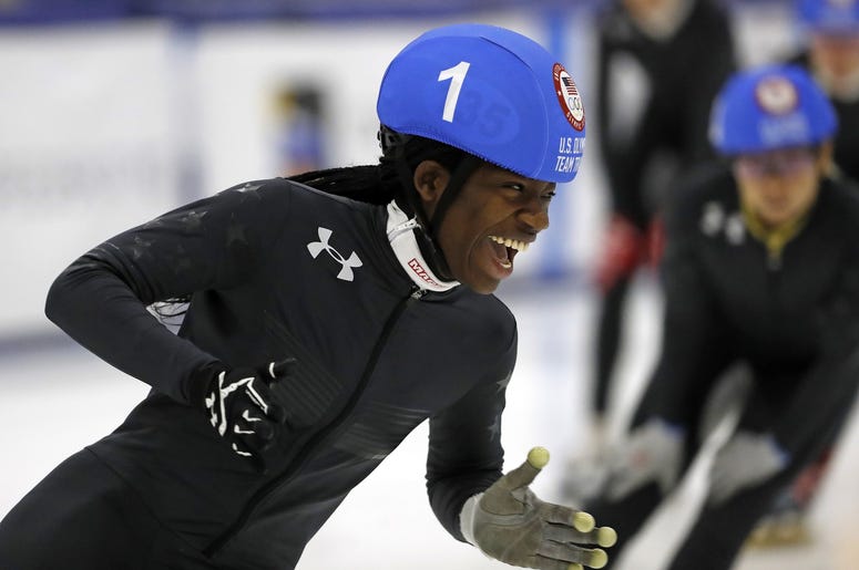 Maame Biney smiles as she competes