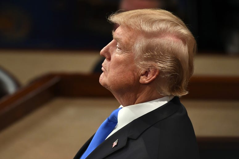 Donald Trump in profile at podium