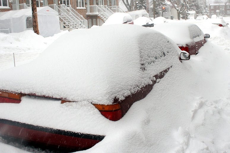 a red car covered in snow