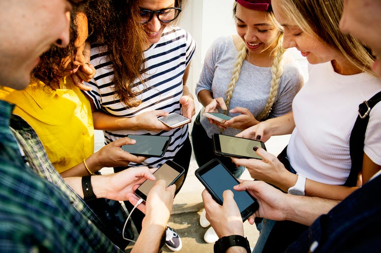Group of young people with smartphones