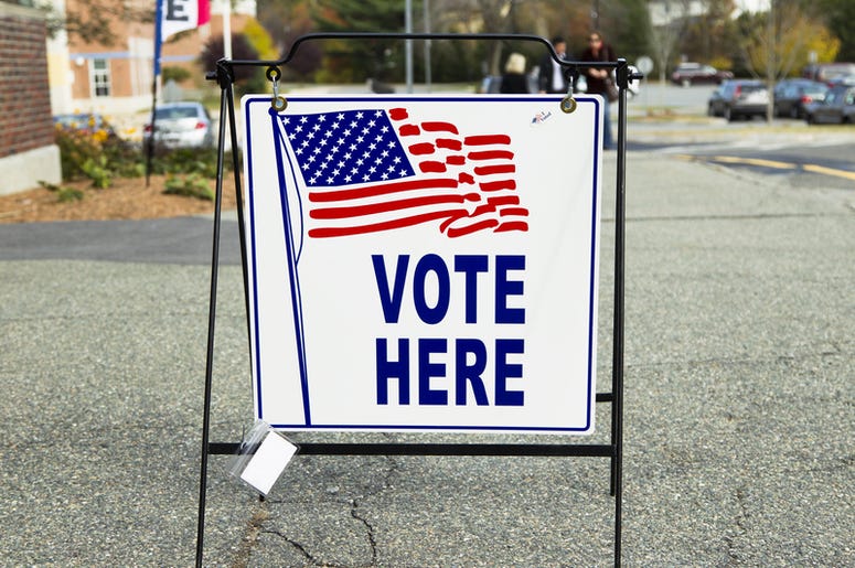vote here sign at an election polling place