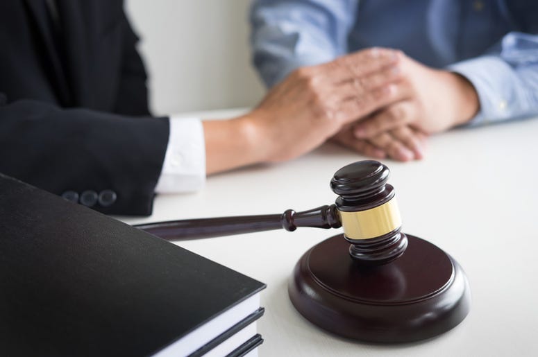 a lawyer meets with a client