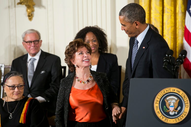 Isabel Allende smiles at Barack Obama as she receives the Presidential medal of Freedom