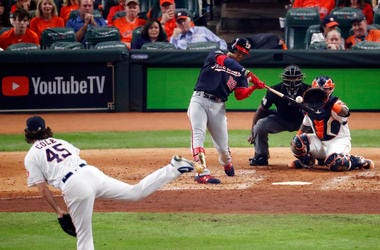 Juan Soto #22 of the Washington Nationals hits a solo home run on a pitch from Gerrit Cole #45 of the Houston Astros during the fourth inning in Game One of the 2019 World Series at Minute Maid Park on October 22, 2019 in Houston, Texas. Juan Soto #22 of the Washington Nationals hits a solo home run on a pitch from Gerrit Cole #45 of the Houston Astros during the fourth inning in Game One of the 2019 World Series at Minute Maid Park on October 22, 2019 in Houston, Texas.
