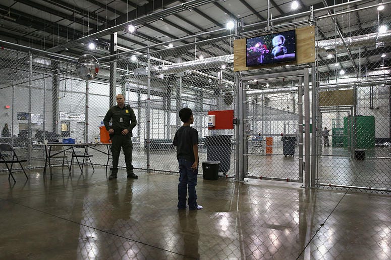 A boy from Honduras watches a movie at a detention facility run by the U.S. Border Patrol on September 8, 2014 in McAllen, Texas. The Border Patrol opened the holding center to temporarily house the children after tens of thousands of families and unaccom A boy from Honduras watches a movie at a detention facility run by the U.S. Border Patrol on September 8, 2014 in McAllen, Texas. The Border Patrol opened the holding center to temporarily house the children after tens of thousands of families and unaccom