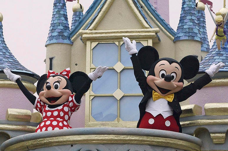 Disney characters Mickey Mouse and Minnie Mouse perform during the parade at Hong Kong Disneyland on September 11, 2005 in Hong Kong. The new theme park is scheduled to have its grand opening September 12.