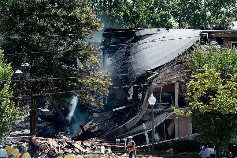 Fire and rescue crews and investigators are seen at the site of an overnight explosion and fire that destroyed an apartment building in the Flower Branch Apartments complex, on August 11, 2016 in Silver Spring, Maryland Fire and rescue crews and investigators are seen at the site of an overnight explosion and fire that destroyed an apartment building in the Flower Branch Apartments complex, on August 11, 2016 in Silver Spring, Maryland