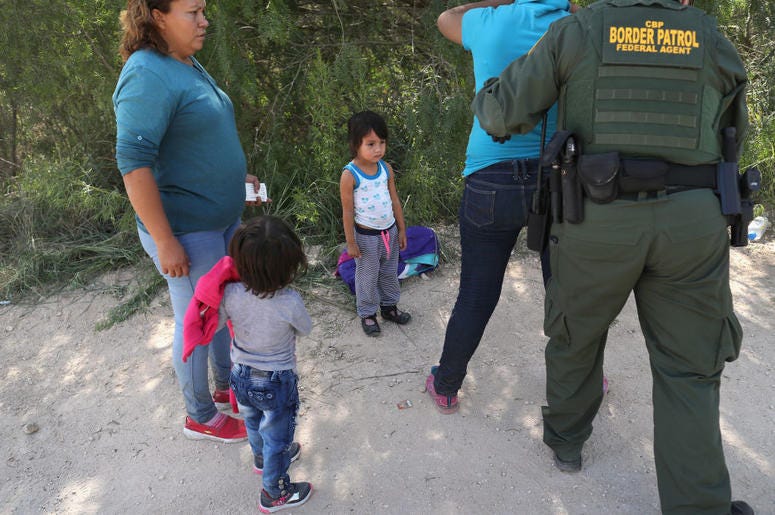 Border Patrol agents take Central American asylum seekers into custody on June 12, 2018 near McAllen, Texas. The immigrant families were then sent to a U.S. Customs and Border Protection (CBP) processing center for possible separation. U.S. border author Border Patrol agents take Central American asylum seekers into custody on June 12, 2018 near McAllen, Texas. The immigrant families were then sent to a U.S. Customs and Border Protection (CBP) processing center for possible separation. U.S. border author