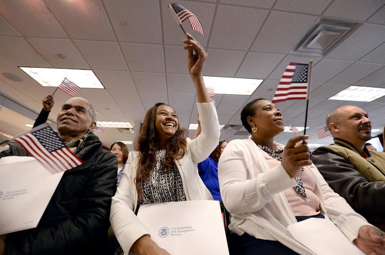 Eusebio Concepcion de Jenkins waives an american flag ceremonial playing of "America the Beautiful" during Naturalization Ceremony for new US Citizens at the offices of U.S. Citizenship and Immigration Services in New York, NY, on January 13, 2017 Eusebio Concepcion de Jenkins waives an american flag ceremonial playing of "America the Beautiful" during Naturalization Ceremony for new US Citizens at the offices of U.S. Citizenship and Immigration Services in New York, NY, on January 13, 2017