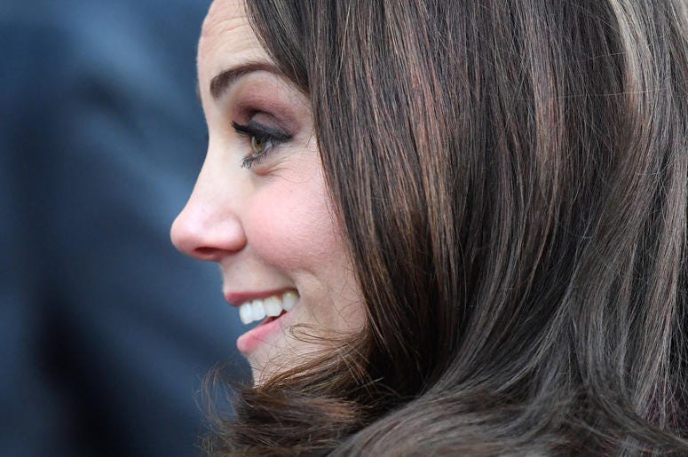 Kate Middleton smiles in profile