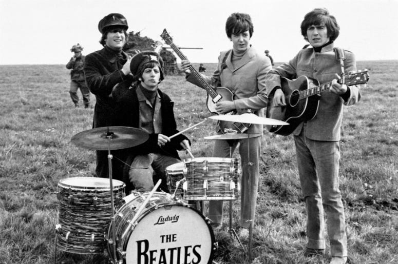 John Lennon, Ringo Starr, Paul McCartney and George Harrison on Salisbury Plain during the filming of 'Help John Lennon, Ringo Starr, Paul McCartney and George Harrison on Salisbury Plain during the filming of 'Help
