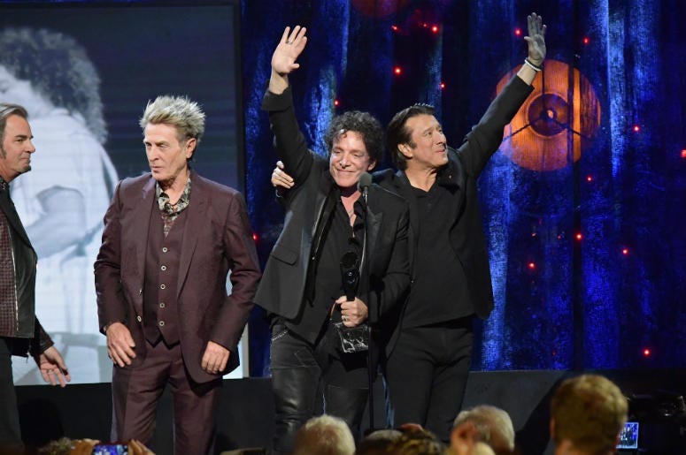 Ross Valory, Neal Schon, and Steve Perry of Journey onstage at the 32nd Annual Rock & Roll Hall Of Fame Induction Ceremony Ross Valory, Neal Schon, and Steve Perry of Journey onstage at the 32nd Annual Rock & Roll Hall Of Fame Induction Ceremony