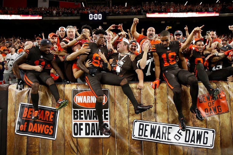 Antonio Callaway #11, Rashard Higgins #81 and Damion Ratley #18 of the Cleveland Browns celebrate with fans