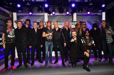 LOS ANGELES, CALIFORNIA - DECEMBER 04: (L-R) Slim Jim Phantom, Rick Allen, Tommy Lee, Vivian Campbell, Joe Elliott, Bret Michaels, Phil Collen, Rick Savage, Rikki Rockett, C.C. DeVille, Nikki Sixx, Vince Neil, Mick Mars, and Bobby Dall speak during the pr