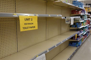 Empty shelves are seen where toilet paper normally is kept when people stocked up as the city government continues to take steps to fight the coronavirus outbreak
