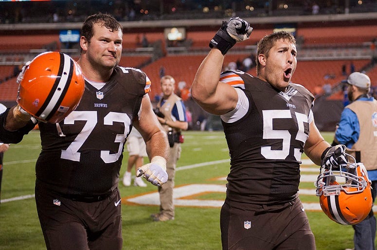 Tackle Joe Thomas #73 and center Alex Mack #55 of the Cleveland Browns celebrate after defeating the Buffalo Bills during the first half at FirstEnergy Stadium on October 3, 2013 in Cleveland, Ohio