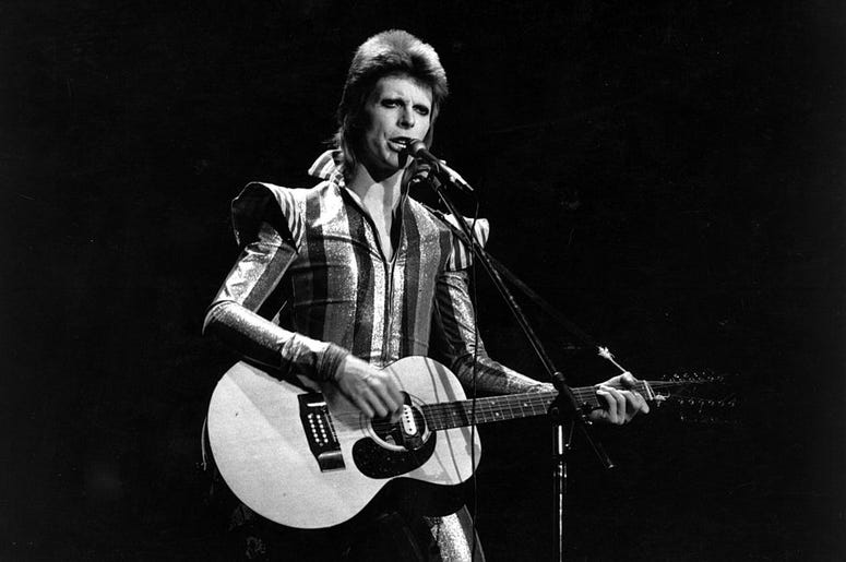 David Bowie performs his final concert as Ziggy Stardust at the Hammersmith Odeon, London. The concert later became known as the Retirement Gig. David Bowie performs his final concert as Ziggy Stardust at the Hammersmith Odeon, London. The concert later became known as the Retirement Gig.