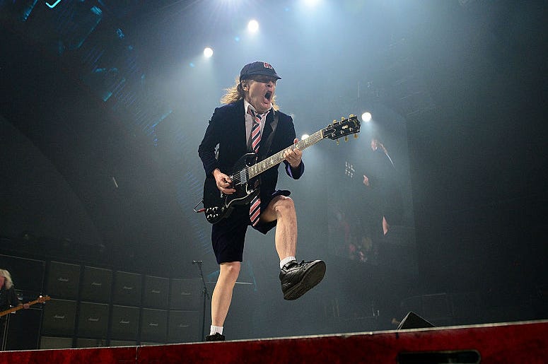 Angus Young performs with AC/DC during the Rock Or Bust Tour at the Greensboro Coliseum on August 27, 2016 in Greensboro, North Carolina. Angus Young performs with AC/DC during the Rock Or Bust Tour at the Greensboro Coliseum on August 27, 2016 in Greensboro, North Carolina.