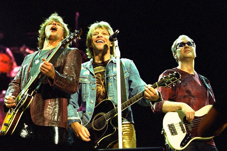 Left to right, Richie Sambora, Jon Bon Jovi and Hugh McDonald of the band Bon Jovi perform Left to right, Richie Sambora, Jon Bon Jovi and Hugh McDonald of the band Bon Jovi perform