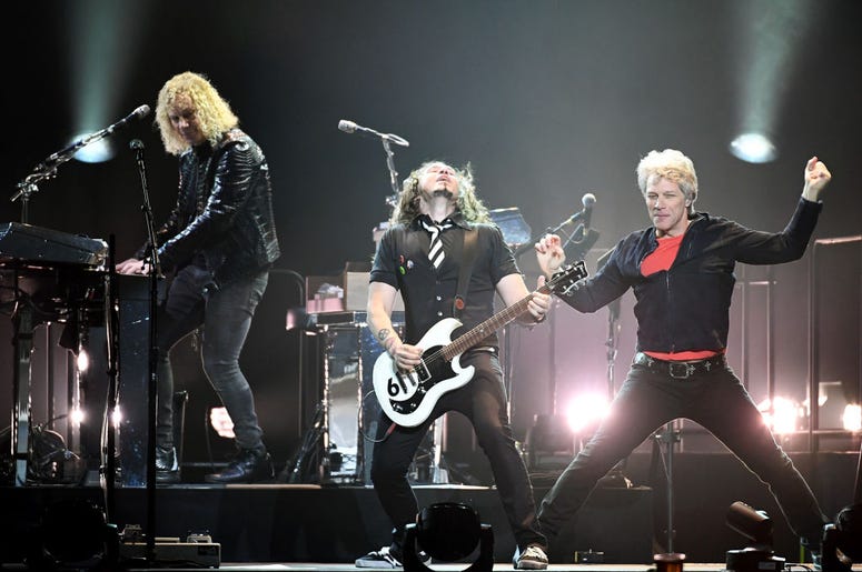 Keyboardist David Bryan, guitarist Phil X and frontman Jon Bon Jovi of Bon Jovi perform during a stop of the band's This House is Not for Sale Tour at T-Mobile Arena on March 17, 2018 in Las Vegas, Nevada. Keyboardist David Bryan, guitarist Phil X and frontman Jon Bon Jovi of Bon Jovi perform during a stop of the band's This House is Not for Sale Tour at T-Mobile Arena on March 17, 2018 in Las Vegas, Nevada.