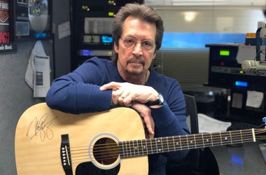 Michael Stanley with a signed acoustic guitar Michael Stanley with a signed acoustic guitar