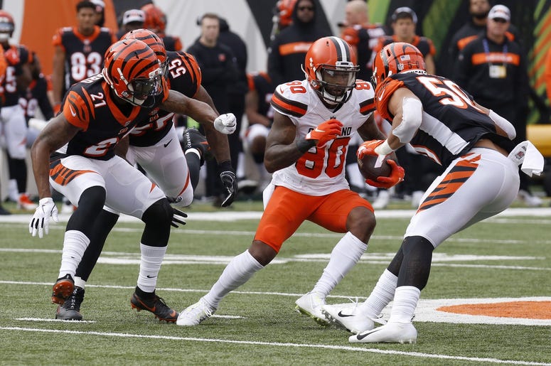 Cleveland Browns wide receiver Jarvis Landry (80) runs against Cincinnati Bengals defensive back Darqueze Dennard (21) and outside linebacker Jordan Evans (50) during the first half at Paul Brown Stadium Cleveland Browns wide receiver Jarvis Landry (80) runs against Cincinnati Bengals defensive back Darqueze Dennard (21) and outside linebacker Jordan Evans (50) during the first half at Paul Brown Stadium