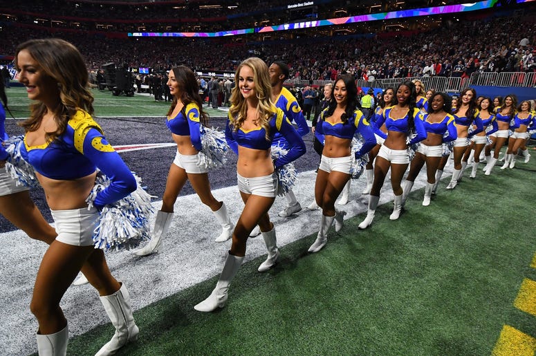 Los Angeles Rams cheerleaders walk onto the field before Super Bowl LIII against the New England Patriots at Mercedes-Benz Stadium. Los Angeles Rams cheerleaders walk onto the field before Super Bowl LIII against the New England Patriots at Mercedes-Benz Stadium.