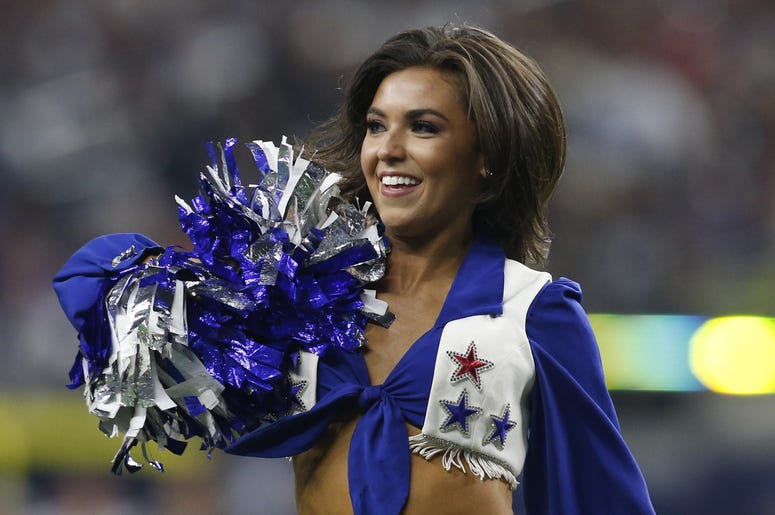 Dallas Cowboys cheerleader performs during a time out in the game against the Buffalo Bills at AT&T Stadium. Dallas Cowboys cheerleader performs during a time out in the game against the Buffalo Bills at AT&T Stadium.