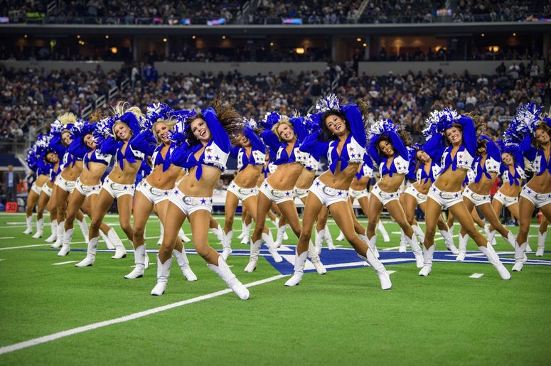 The Dallas Cowboys cheerleaders perform during the game between the Cowboys and the Buffalo Bills at AT&T Stadium. The Dallas Cowboys cheerleaders perform during the game between the Cowboys and the Buffalo Bills at AT&T Stadium.