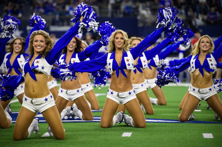 he Dallas Cowboys cheerleaders perform during the game between the Cowboys and the Buffalo Bills at AT&T Stadium. he Dallas Cowboys cheerleaders perform during the game between the Cowboys and the Buffalo Bills at AT&T Stadium.