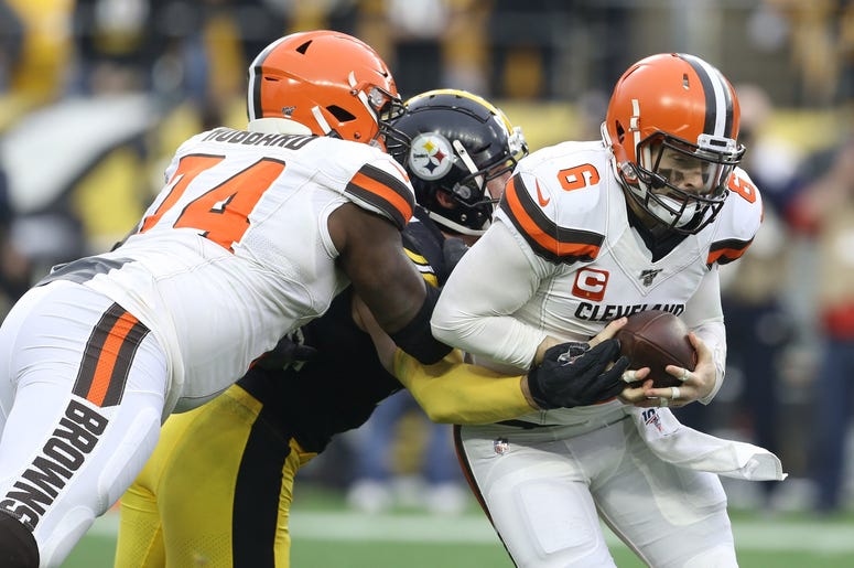 Cleveland Browns quarterback Baker Mayfield (6) scrambles away from Pittsburgh Steelers outside linebacker T.J. Watt (90) as offensive tackle Chris Hubbard (74) blocks during the second quarter at Heinz Field. Cleveland Browns quarterback Baker Mayfield (6) scrambles away from Pittsburgh Steelers outside linebacker T.J. Watt (90) as offensive tackle Chris Hubbard (74) blocks during the second quarter at Heinz Field.