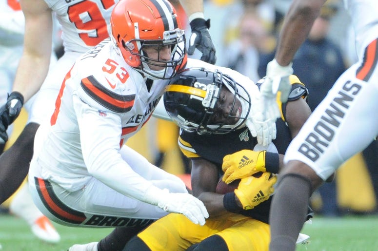 Pittsburgh Steelers wide receiver James Washington (13) is stopped by Cleveland Browns linebacker Joe Schobert (53) during the second quarter at Heinz Field. The Steelers won 20-13. Pittsburgh Steelers wide receiver James Washington (13) is stopped by Cleveland Browns linebacker Joe Schobert (53) during the second quarter at Heinz Field. The Steelers won 20-13.