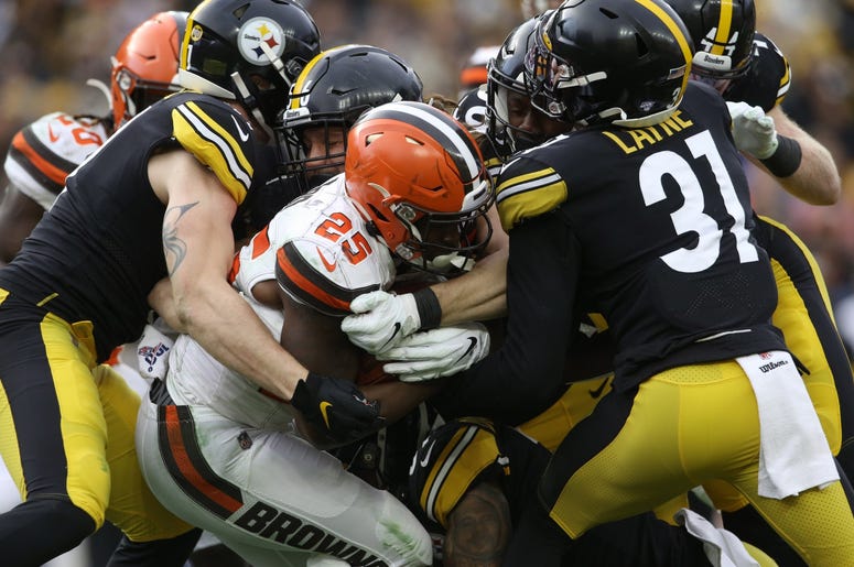 ittsburgh Steelers linebacker Robert Spillane (left) and linebacker Anthony Chickillo (56) and cornerback Justin Layne (31) tackle Cleveland Browns running back Dontrell Hilliard (25) during the fourth quarter at Heinz Field. The Steelers won 20-13. ittsburgh Steelers linebacker Robert Spillane (left) and linebacker Anthony Chickillo (56) and cornerback Justin Layne (31) tackle Cleveland Browns running back Dontrell Hilliard (25) during the fourth quarter at Heinz Field. The Steelers won 20-13.