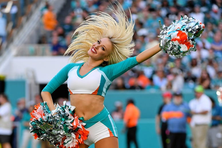 A Miami Dolphins cheerleader performs during the second half between the Miami Dolphins and the Philadelphia Eagles at Hard Rock Stadium. A Miami Dolphins cheerleader performs during the second half between the Miami Dolphins and the Philadelphia Eagles at Hard Rock Stadium.