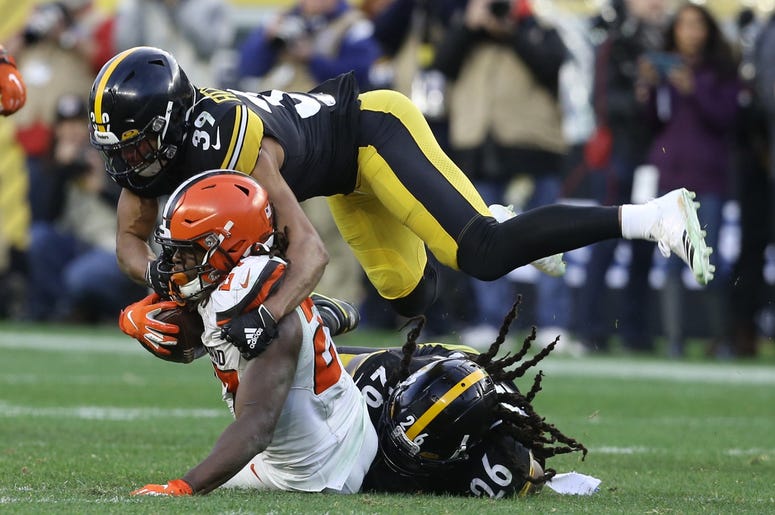 Pittsburgh Steelers free safety Minkah Fitzpatrick (39) and inside linebacker Mark Barron (26) tackle Cleveland Browns running back Kareem Hunt (27) during the fourth quarter at Heinz Field.The Steelers won 20-13. Pittsburgh Steelers free safety Minkah Fitzpatrick (39) and inside linebacker Mark Barron (26) tackle Cleveland Browns running back Kareem Hunt (27) during the fourth quarter at Heinz Field.The Steelers won 20-13.