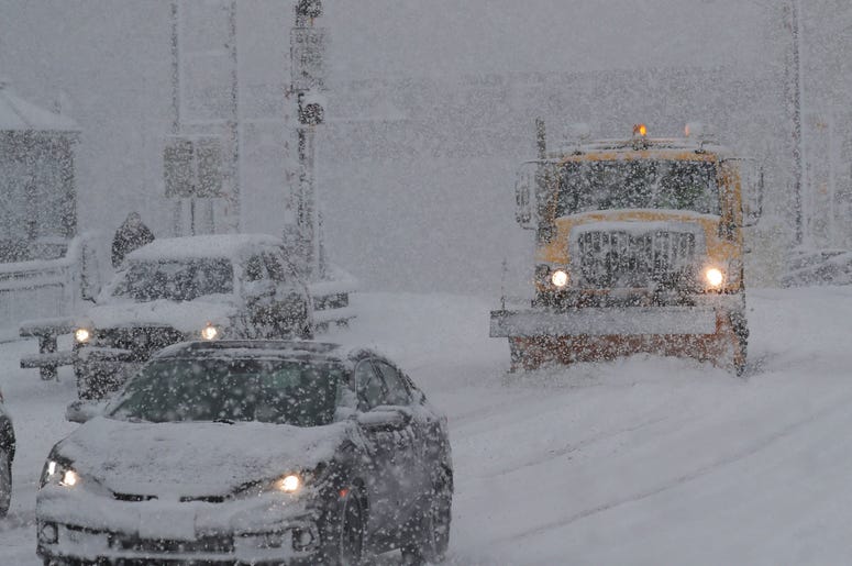 A City of Milwaukee snow plow clears snow on West State Street near North Old World Third Street. Snow 18335