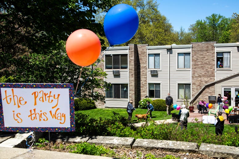 Balloons help direct people towards a party for Jeanne Kuentzel while she celebrates her 100th birthday with family members and Oaknoll staff, Friday, May 8, 2020, at Oaknoll Retirement Residence in Iowa City, Iowa. 200508 Birthday 100 001 Jpg