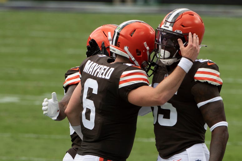 Sep 13, 2020; Baltimore, Maryland, USA; Cleveland Browns quarterback Baker Mayfield (6) celebrates with tight end David Njoku (85) after a first quarter touchdown against the Baltimore Ravens at M&T Bank Stadium. Mandatory Credit: Tommy Gilligan-USA TODAY