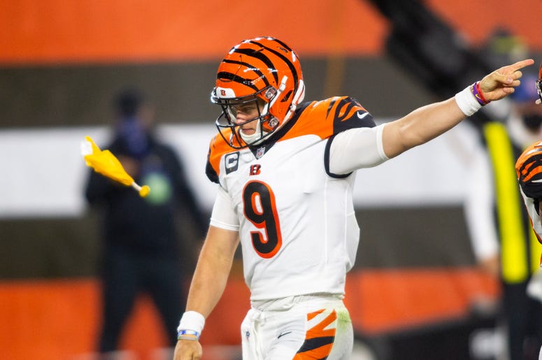 Sep 17, 2020; Cleveland, Ohio, USA; Cincinnati Bengals quarterback Joe Burrow (9) signals to the Cleveland Browns for an encroachment penalty as a flag is thrown during the third quarter at FirstEnergy Stadium. Mandatory Credit: Scott Galvin-USA TODAY Spo