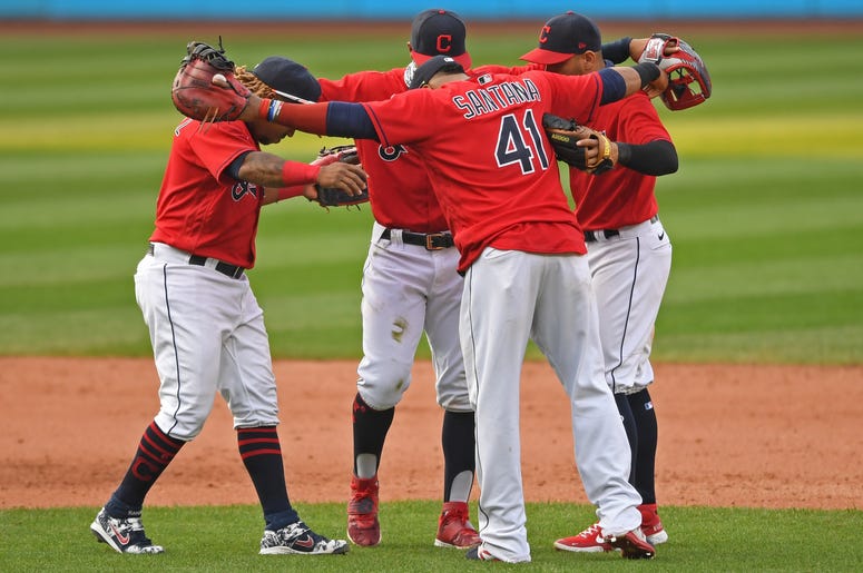 Sep 27, 2020; Cleveland, Ohio, USA; Cleveland Indians third baseman Jose Ramirez (11) short stop Francisco Lindor (12) second basemen Cesar Hernandez (7) and first basemen Carlos Santana (41) celebrate after the Indians defeated the Pittsburgh Pirates at